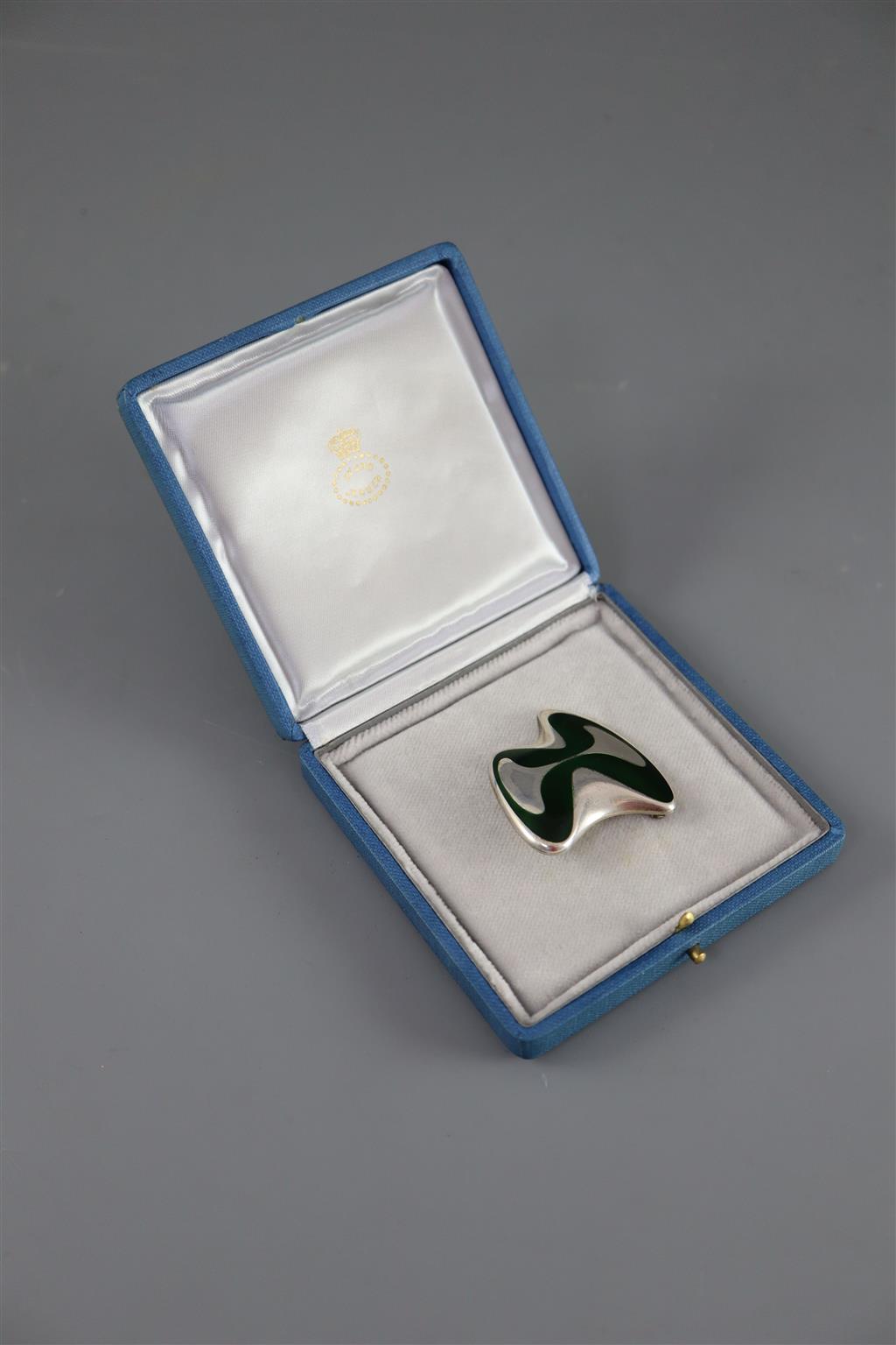 A late 1960s Danish Georg Jensen silver and green enamel abstract brooch, designed by Henning Koppel, design no. 315,